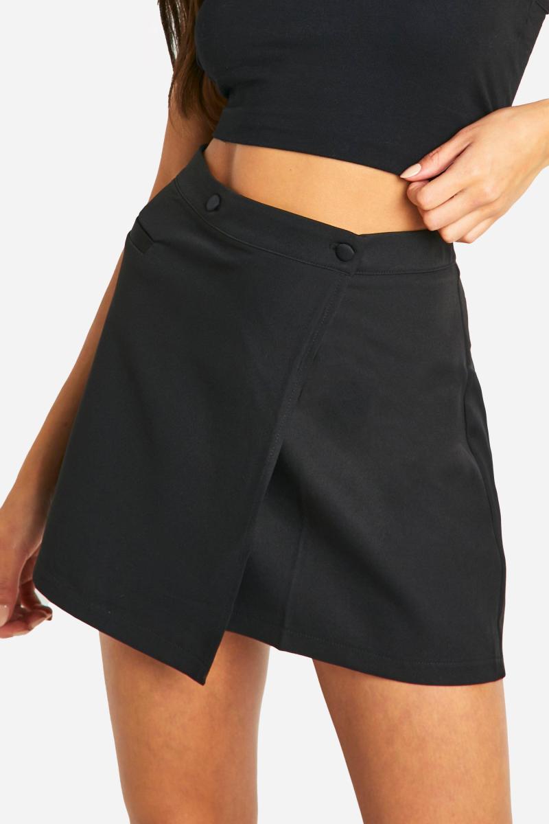 Міні-спідниця з накидкою поверх