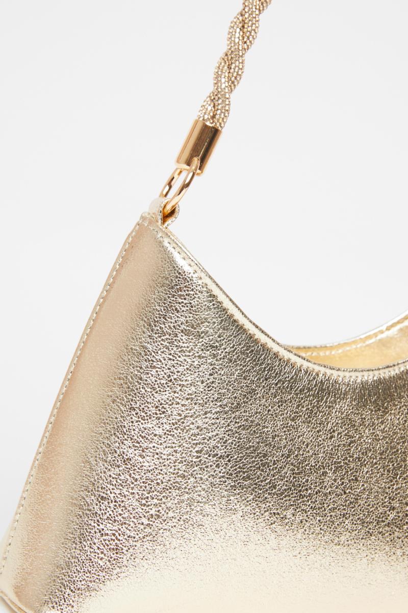 Золота діаманте поворотна сумка