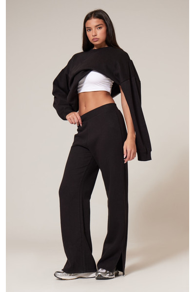 Чорні розкльошені джоггери з розділеним подолом