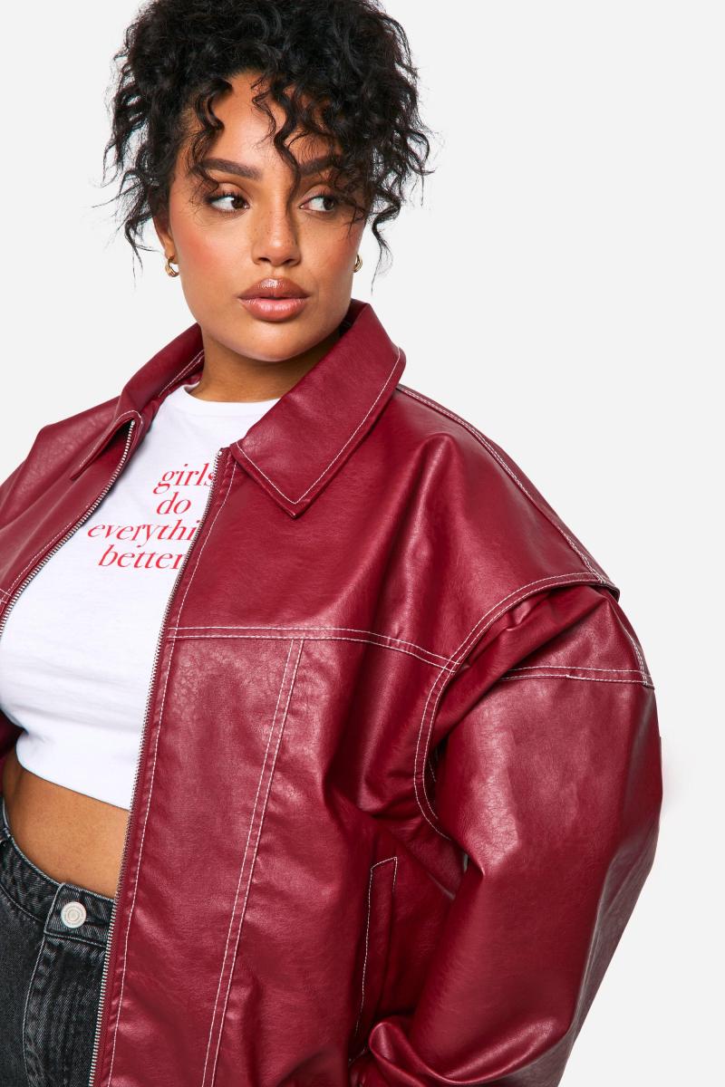 Плюс великий бомбер з контрастним стібком Pu