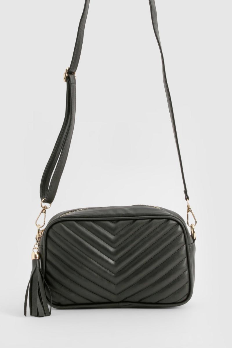 Стьобана шкіряна сумка через плече з китицями