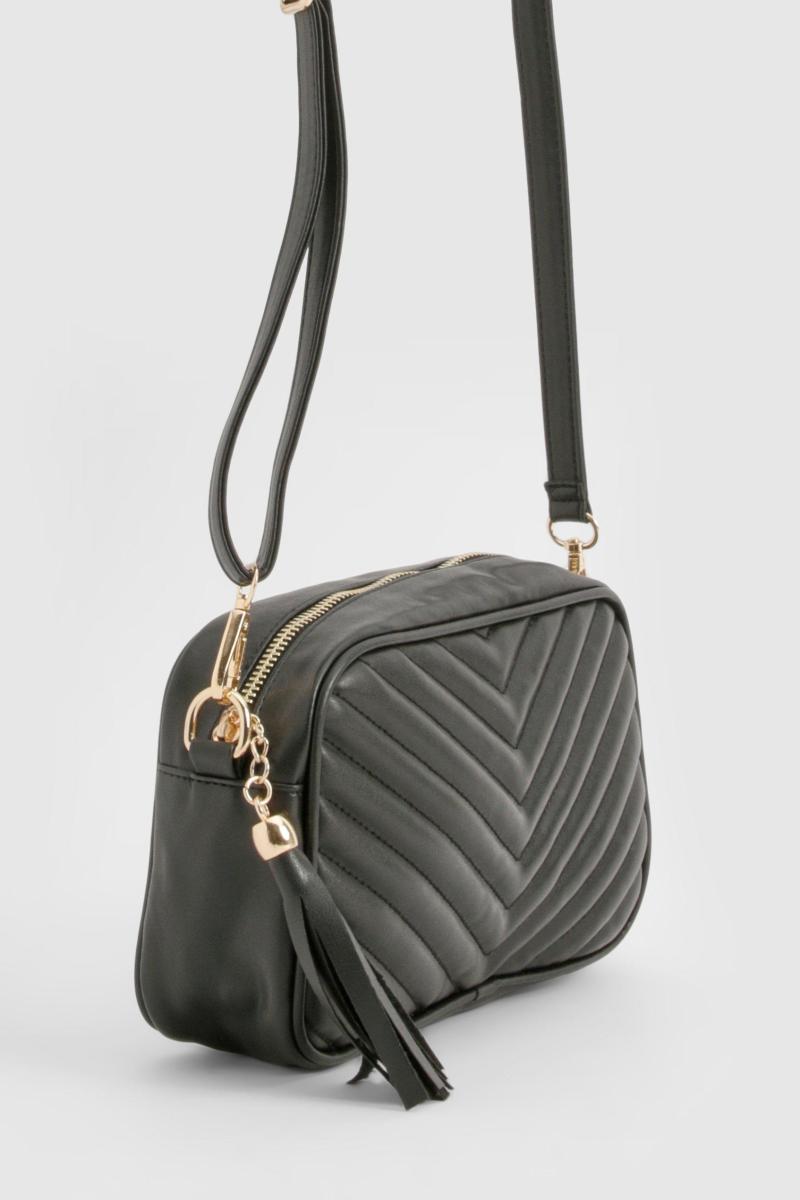 Стьобана шкіряна сумка через плече з китицями