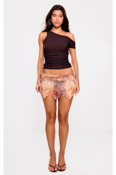 Помаранчева сітчаста міні-спідниця на підкладці з асиметричним подолом і оборками Помаранчева сітчаста міні-спідниця на підкладці з асиметричним подолом і оборками